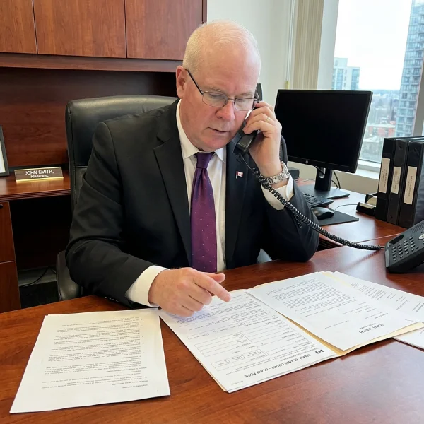 paralegal on phone in office